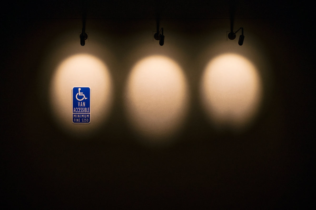 three lights that are on the side of a wall